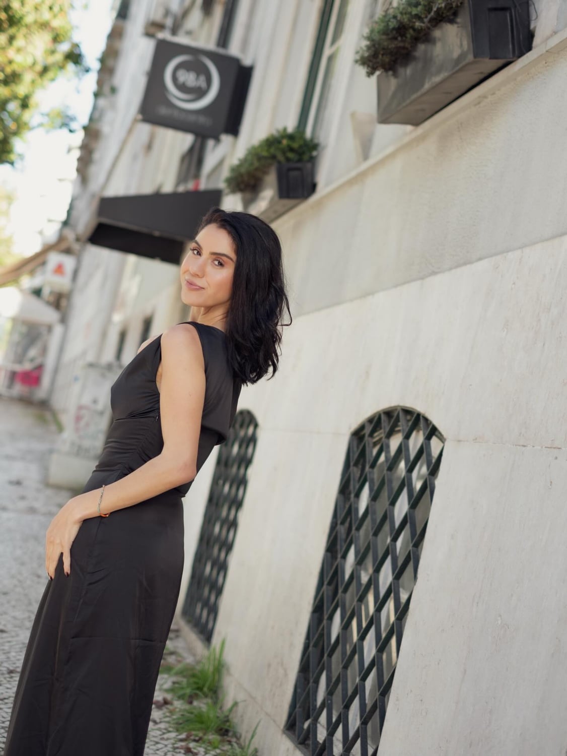 Full-length street-style portrait of Kimia in black