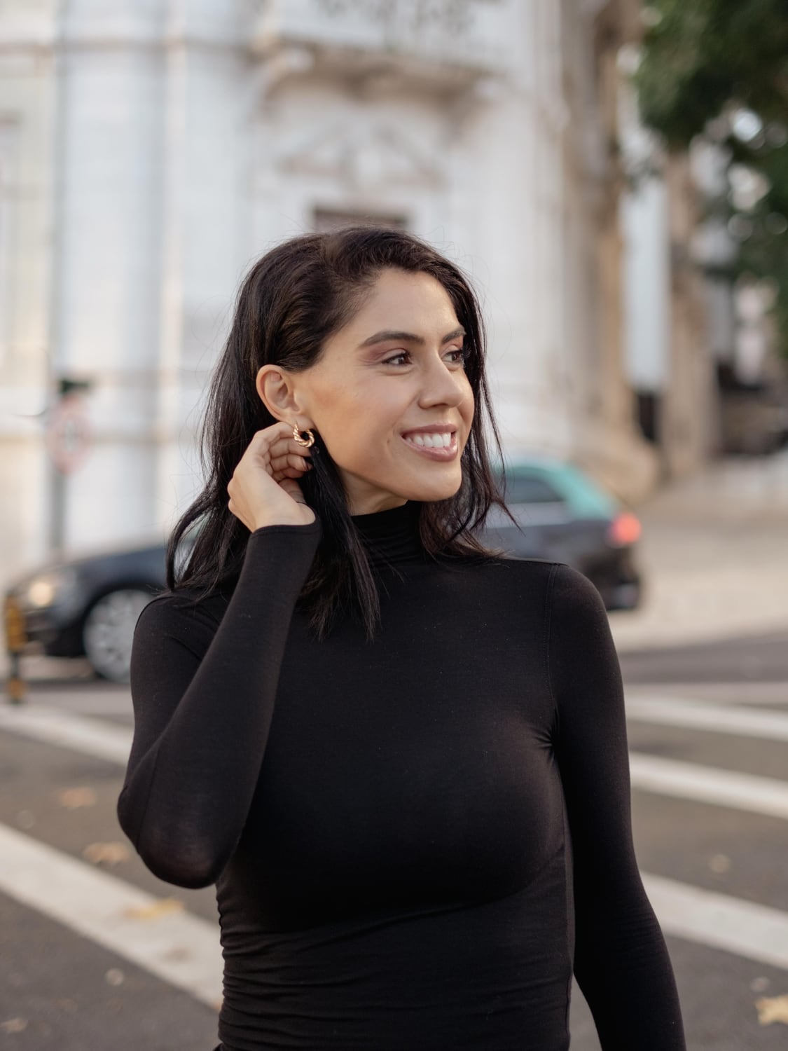 Street portrait of Kimia in a black turtleneck in Lisbon